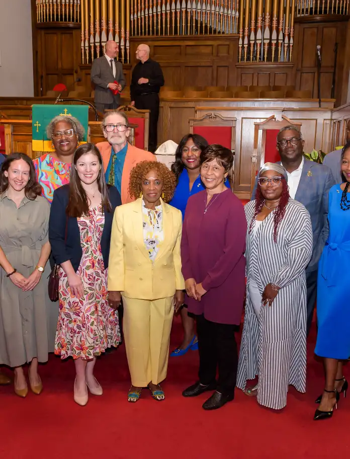 A group photo inside the Baptist Church