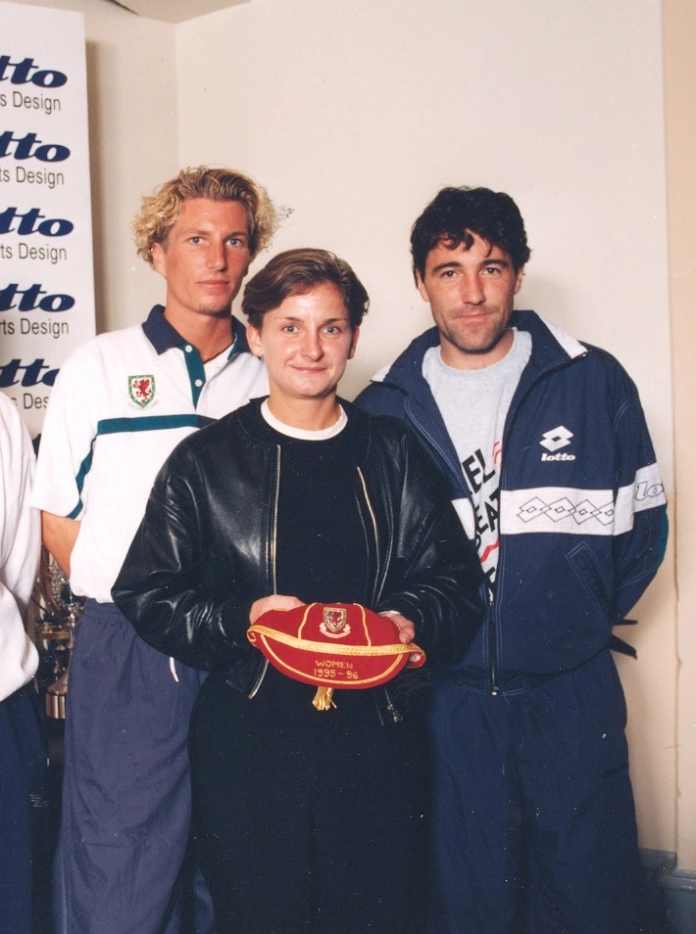 Three people smiling at the camera.