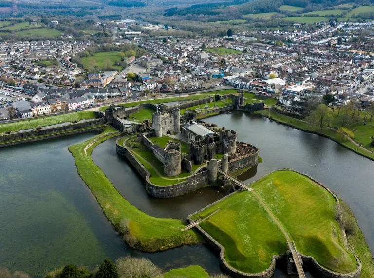 Aerial view of Caerphilly Castle and the moat surrounding it