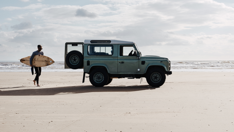 Surfer and van, Rest Bay