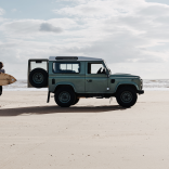Surfer and van, Rest Bay