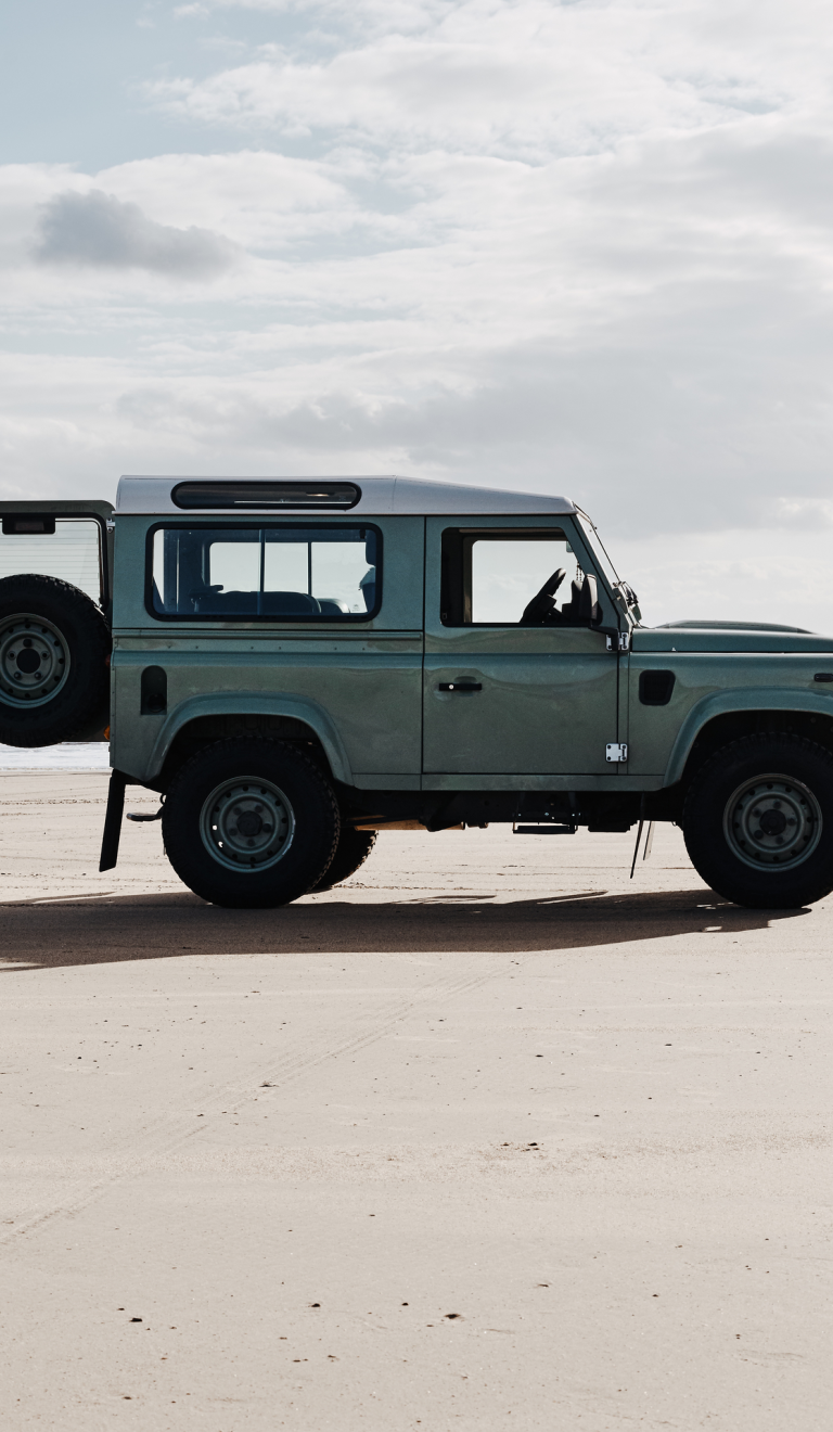 Surfer and van, Rest Bay