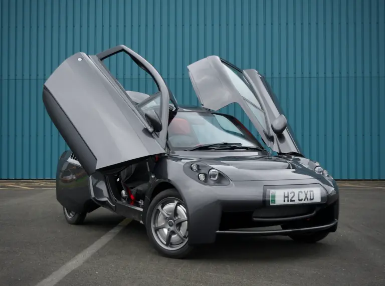 A black car with the doors open.