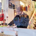 Huw Stephens looking through records in Spillers, Cardiff's Victorian Arcades