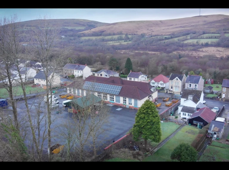 Aerial photo above Hwb y Gors/former Cwmgors Primary School – playground location where Sustainable Drainage Scheme to be built including rain gardens and pond.