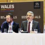 Four people sitting at a desk