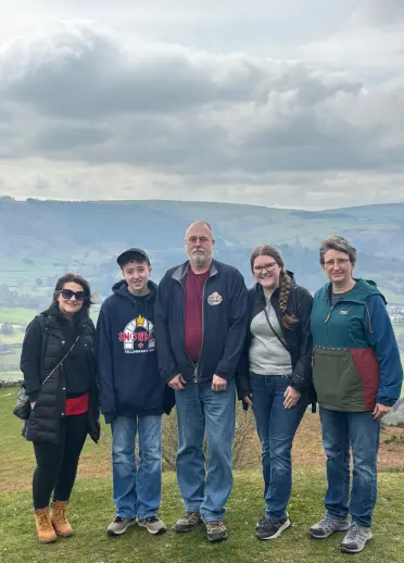 Five people standing on a mountain in Wales