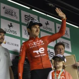 Geraint Thomas waving from a stage