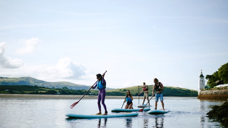 Stand-up paddleboarding in Portmeirion. 