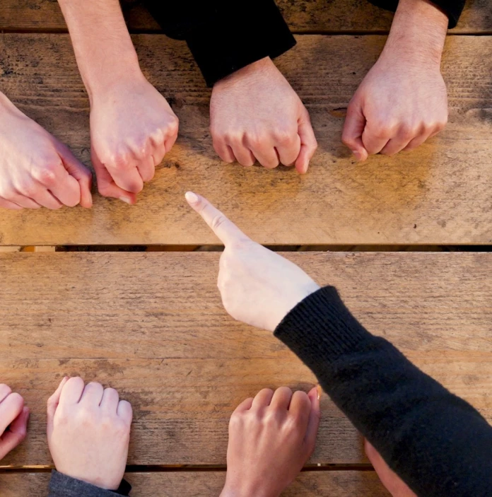 A series of hands playing a hand game