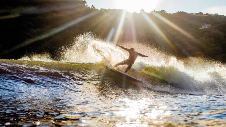 surfer with sun shining, Surf Snowdonia