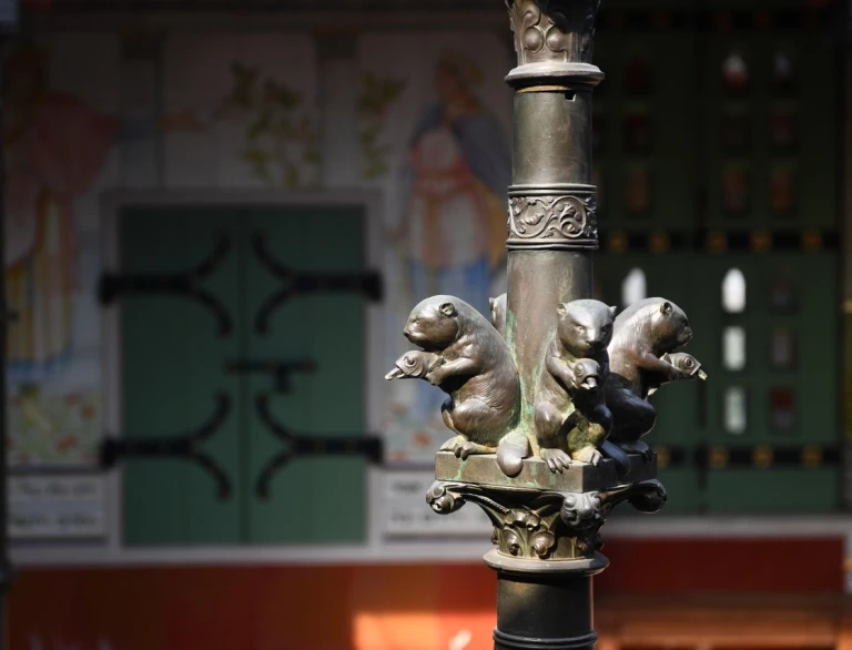 Close up detail of otter and duck metalwork in an old castle