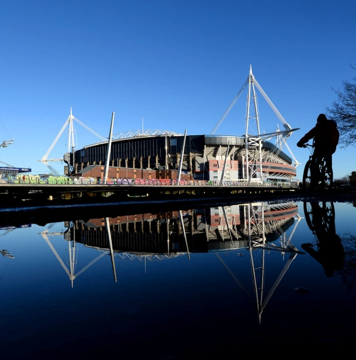 View of large sports stadium from across river