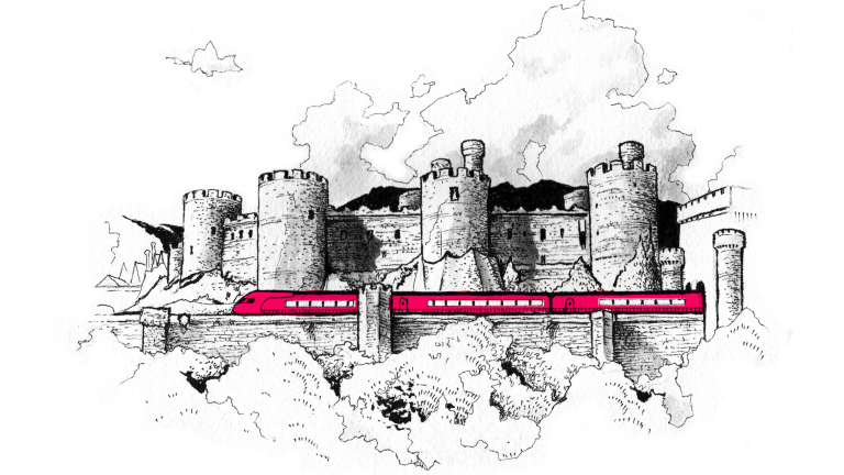 Tren pasando por Castillo de Conwy