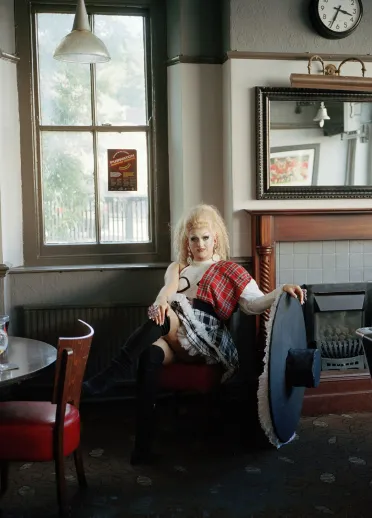 Drag queen Catrin Feelings sitting in a Welsh pub