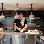 kitchen with man (chef) preparing food