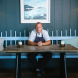 Hywel Griffith sat at a table in his restaurant Beach House.