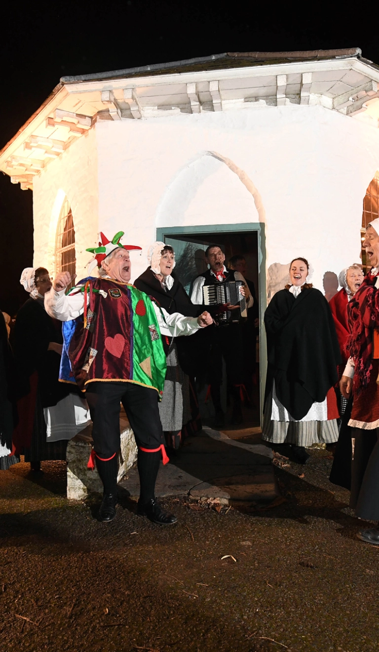 A Mari Lwyd and dancers.