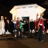 A Mari Lwyd and dancers.