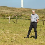Derek  Walker standing in a field